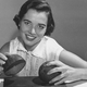 Woman using coconuts to emulate sound of horse's hooves